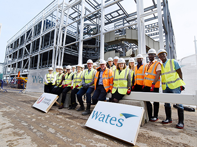 Staff, students and members of the Wates Construction team at the Digital Life building . Link to Milestone reached on landmark development at Teesside University.