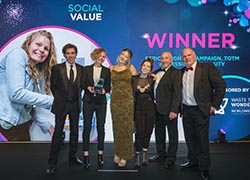 Actor Stephen Mangan, who hosted the IWFM Impact Awards event, pictured with Vik Brown holding the award, and representatives from TOTM and IWFM 