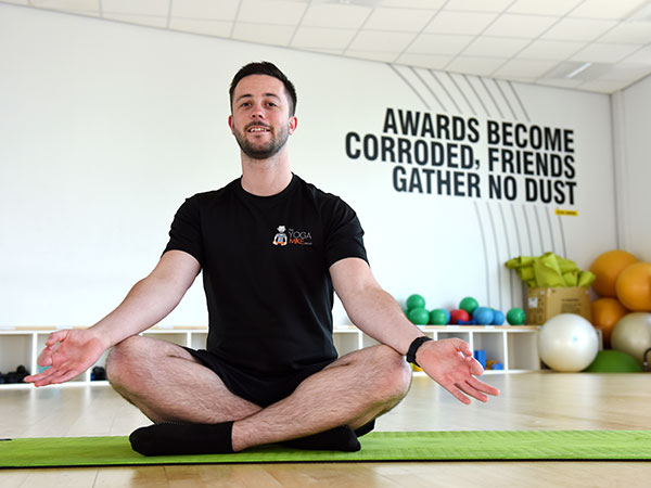 Teesside University staff doing yoga in the gym 